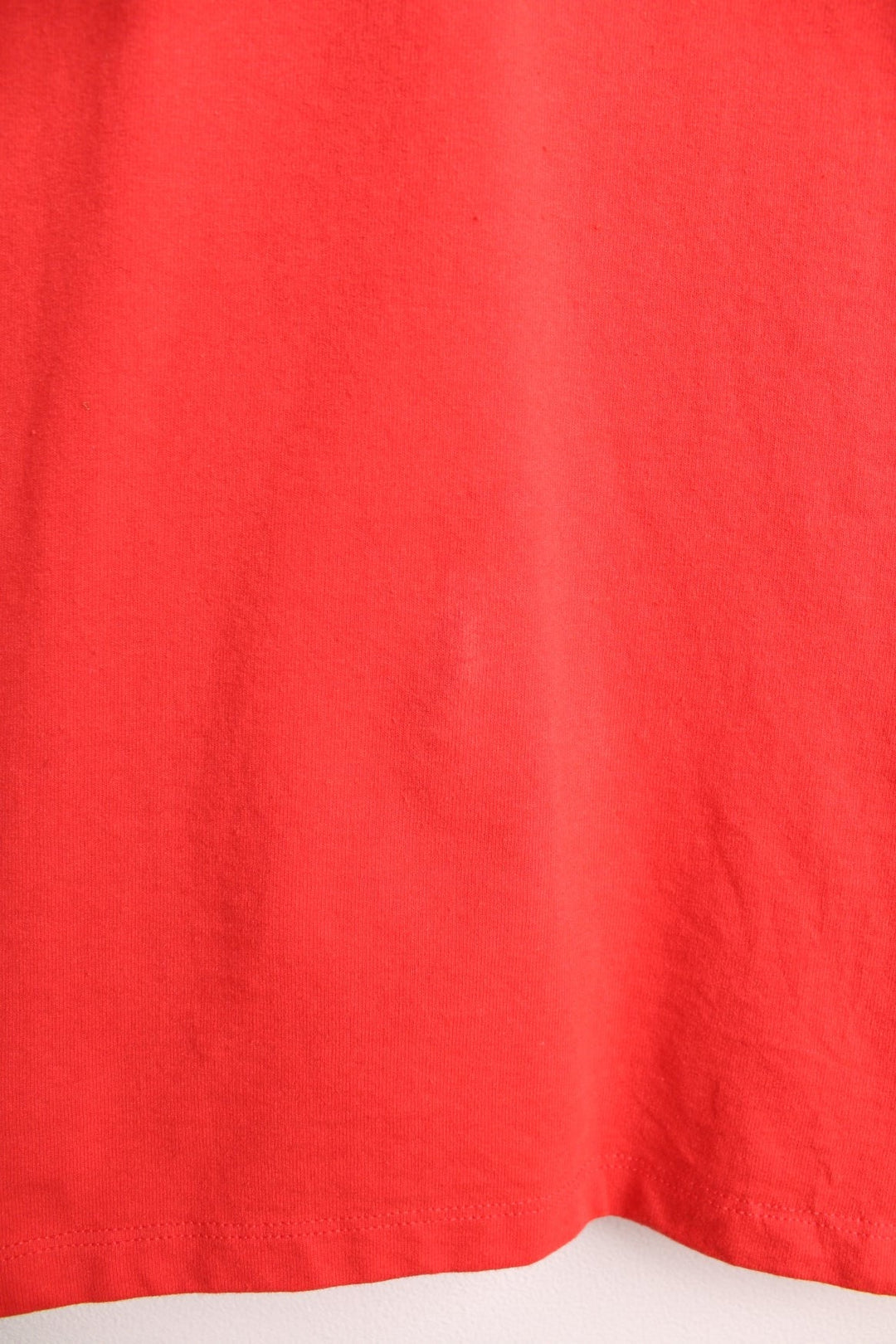 Red North Face long-sleeved t-shirt with 'Year of the Tiger' design on the top left.