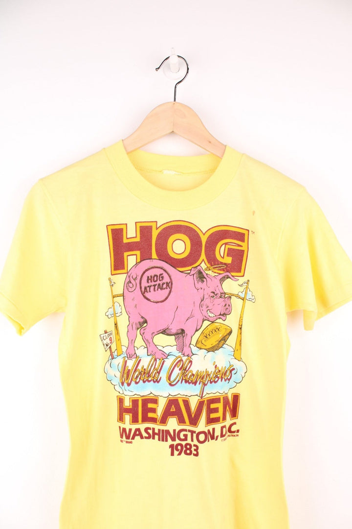 1983 Washington Redskins 'Hog Heaven' World Championships tee in yellow with pig and clouds design.