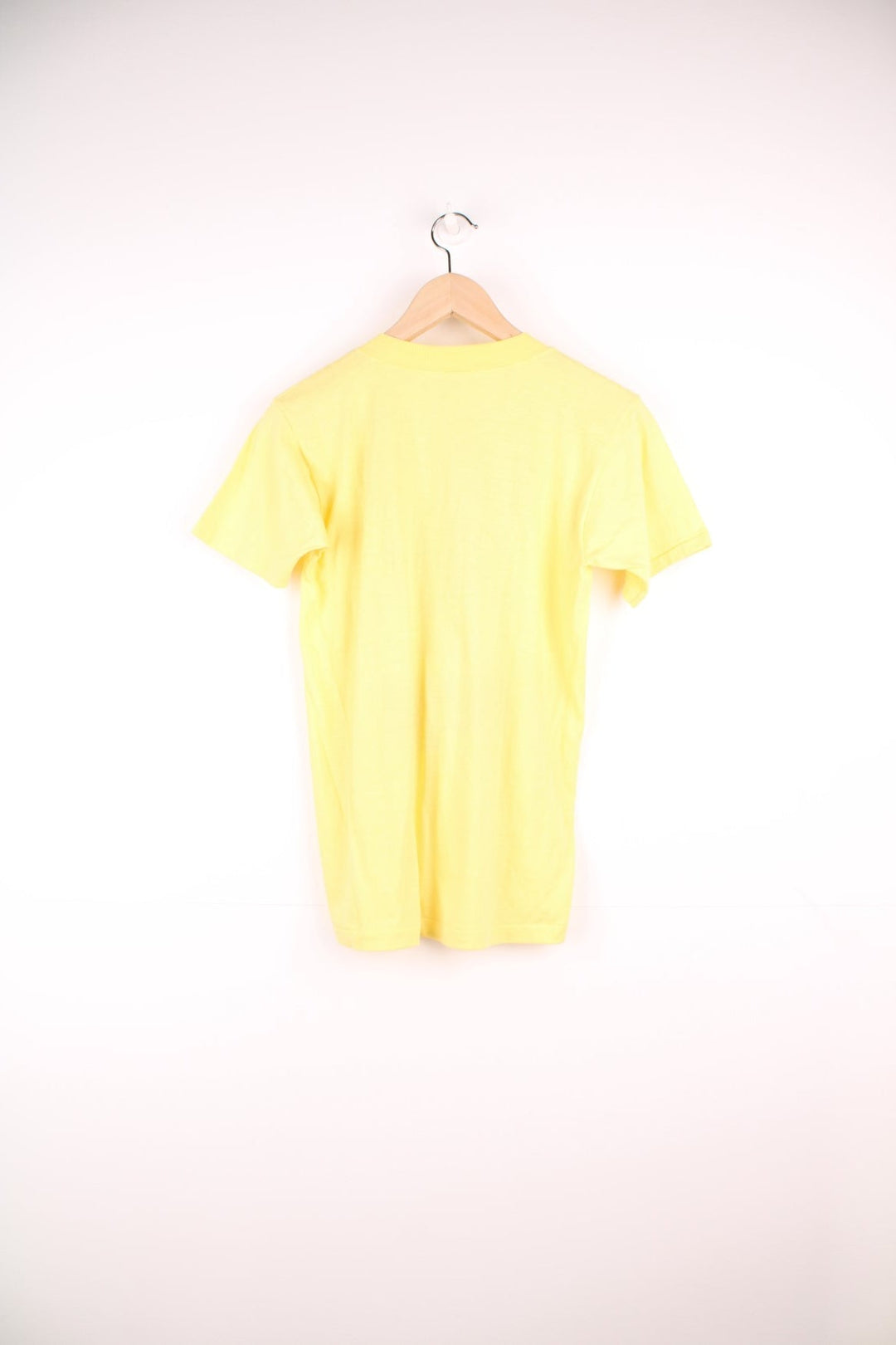 1983 Washington Redskins 'Hog Heaven' World Championships tee in yellow with pig and clouds design.