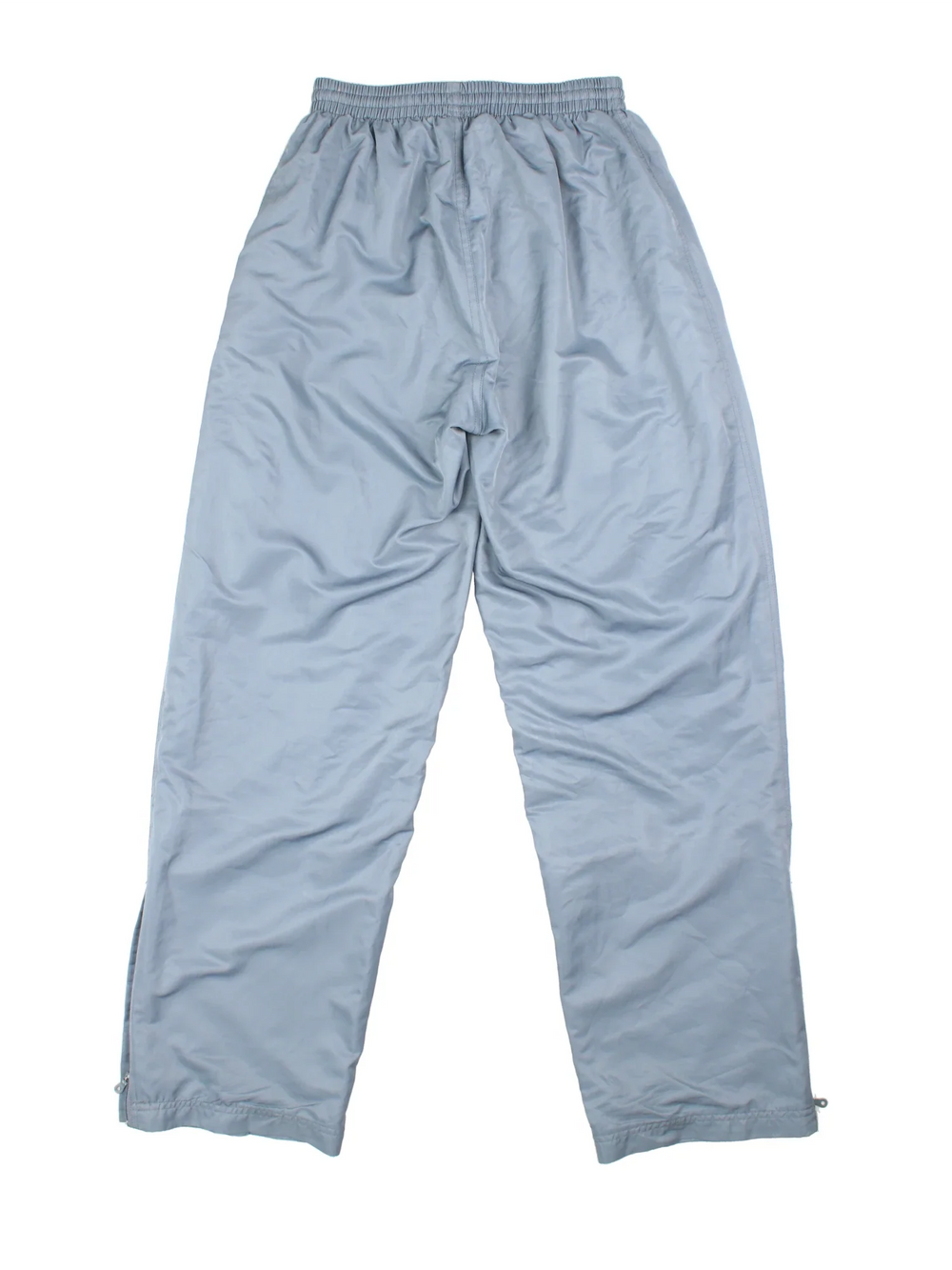 90's Nike Tracksuit Bottoms in grey colourway. Side pockets, elasticated waist, contrast piping and the logo embroidered on the front.