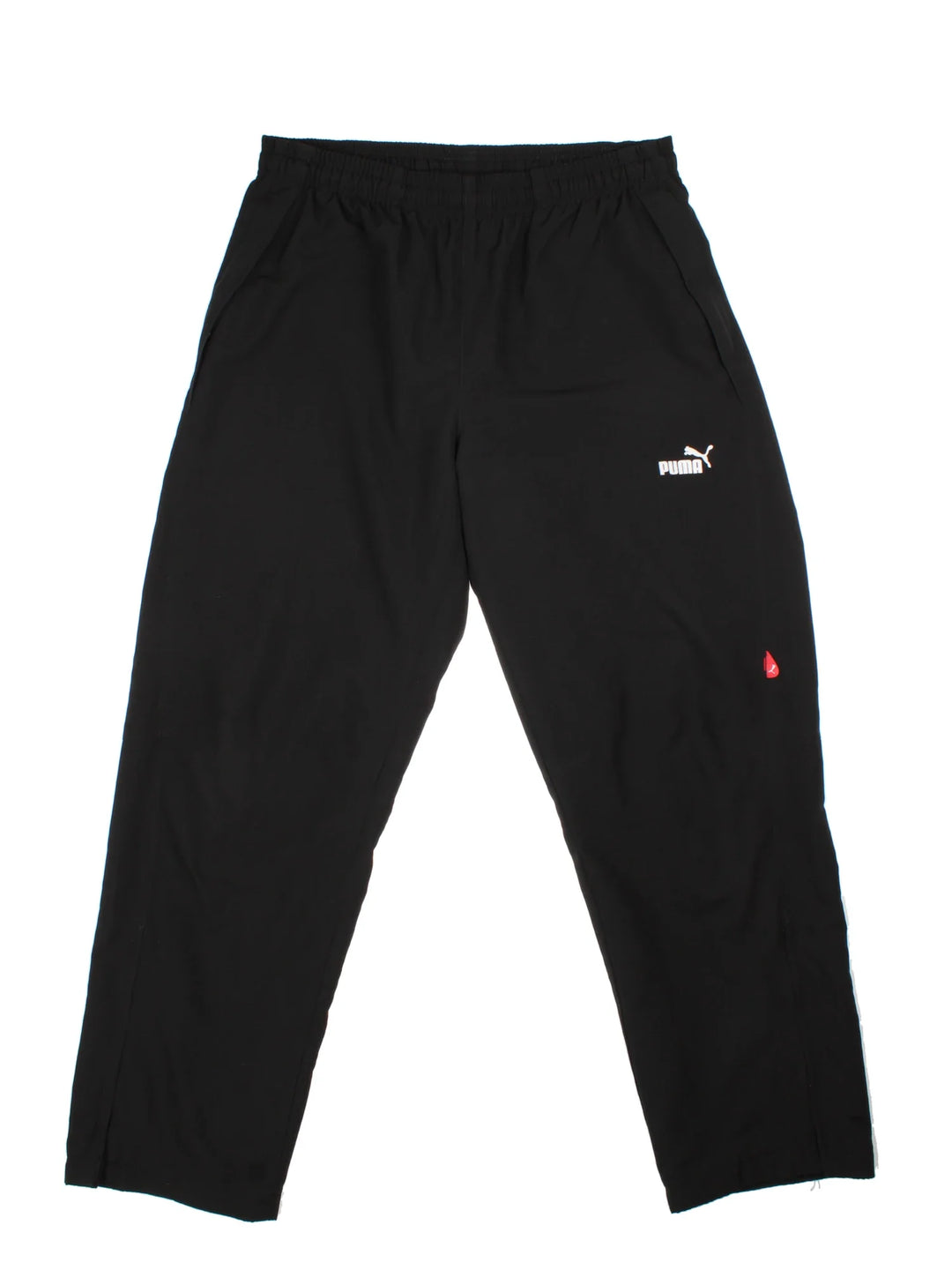 Puma Tracksuit Bottoms in a black colourway with pockets, elasticated waist with drawstring, mesh lining, and the logo embroidered on the front.