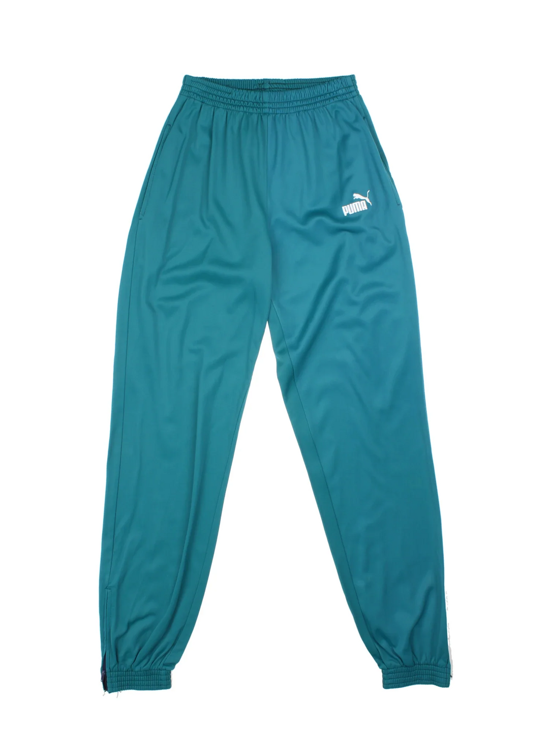Puma Tracksuit Bottoms in a turqouise green colourway with pockets, elasticated waist, and the logo embroidered on the front.