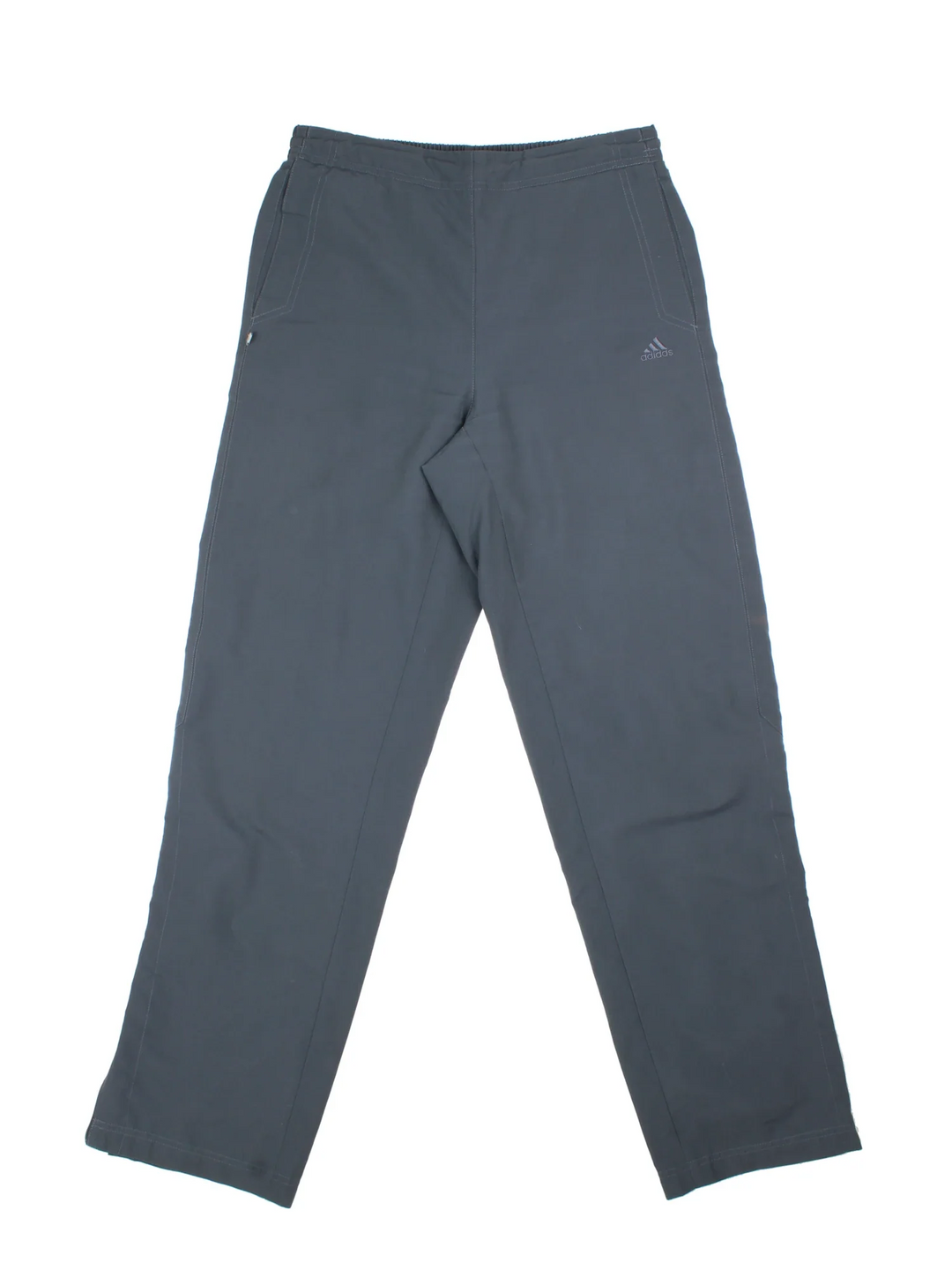 Adidas Tracksuit Bottoms in a grey colourway with pockets, adjustable waist with drawstring, and the logo embroidered on the front.