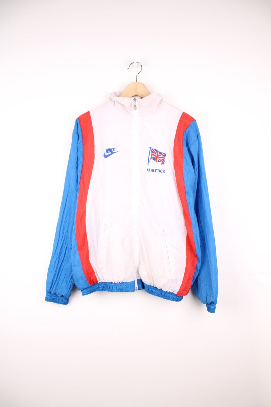 Nike GB Athletics windbreaker tracksuit top in white, red and blue. Features embroidered logos on the chest.