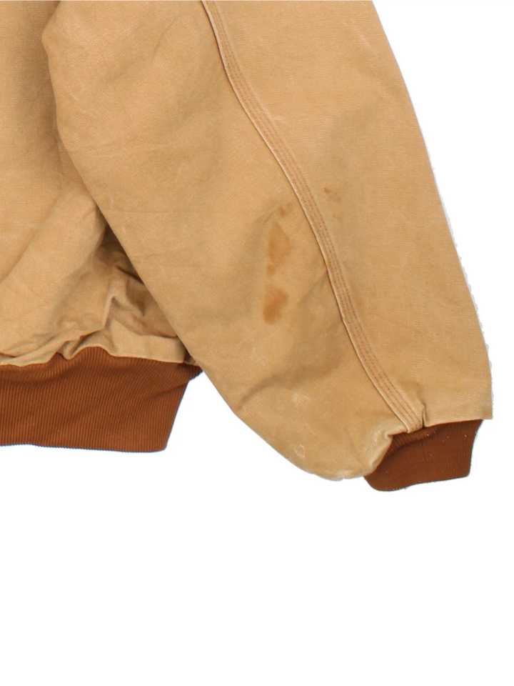 Vintage Carhartt Active Jacket in a tan colourway. Zip up closure and has side pockets, insulated lining, and has the logo embroidered on the front.