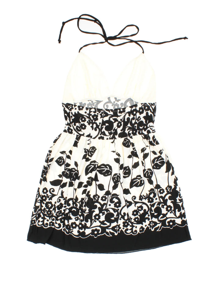 Y2K Vintage Halter Neck Top in a black/white colourway. V neckline, with frill detail and halter neck tie.