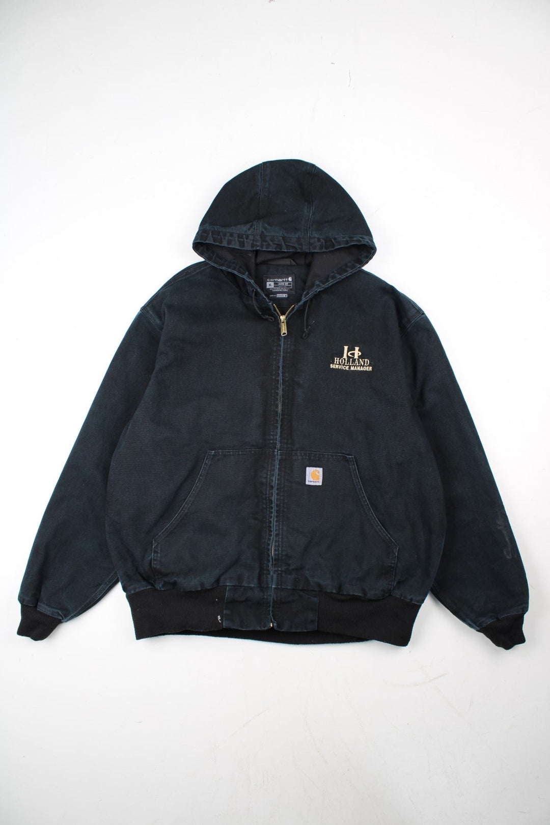 Carhartt Active Jacket in a black colourway. Zips up and has side pockets, hooded, and has the logo embroidered on the front alongside 'Holland Service Manager' company spell out.