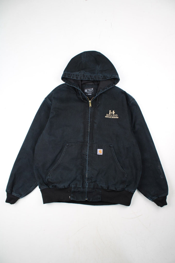 Carhartt Active Jacket in a black colourway. Zips up and has side pockets, hooded, and has the logo embroidered on the front alongside 'Holland Service Manager' company spell out.