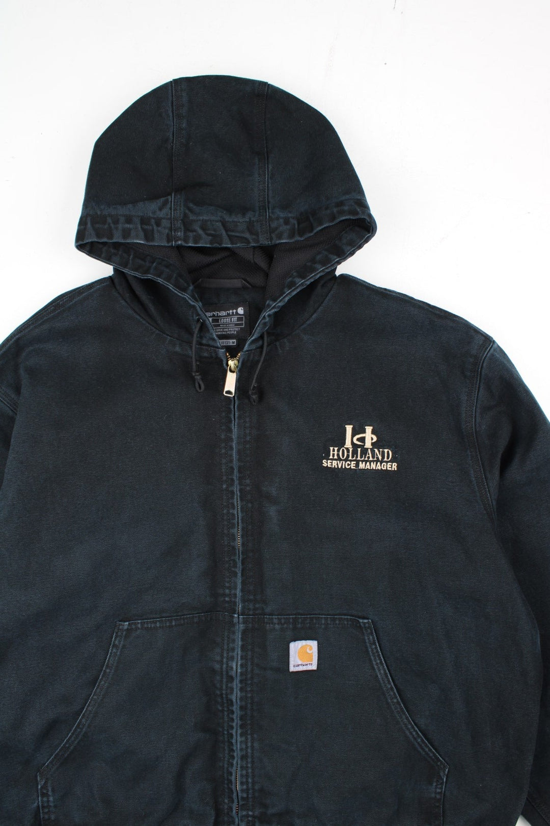Carhartt Active Jacket in a black colourway. Zips up and has side pockets, hooded, and has the logo embroidered on the front alongside 'Holland Service Manager' company spell out.
