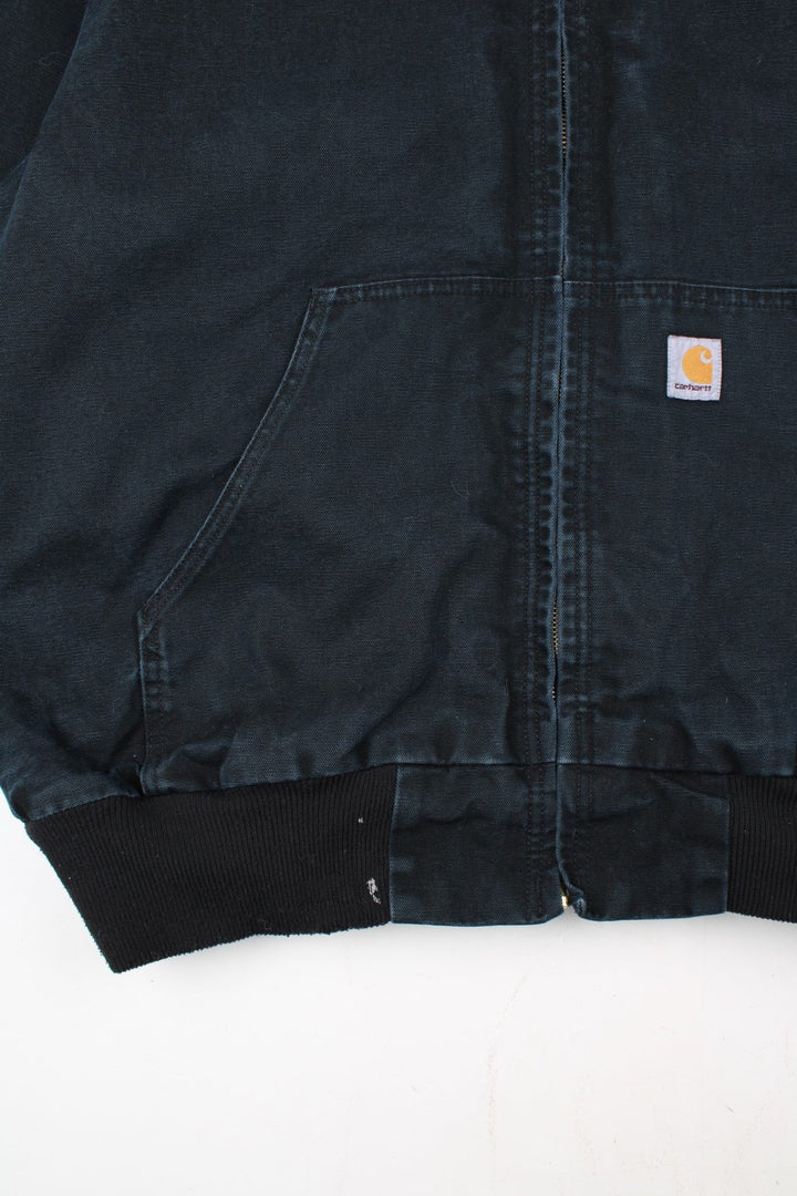 Carhartt Active Jacket in a black colourway. Zips up and has side pockets, hooded, and has the logo embroidered on the front alongside 'Holland Service Manager' company spell out.