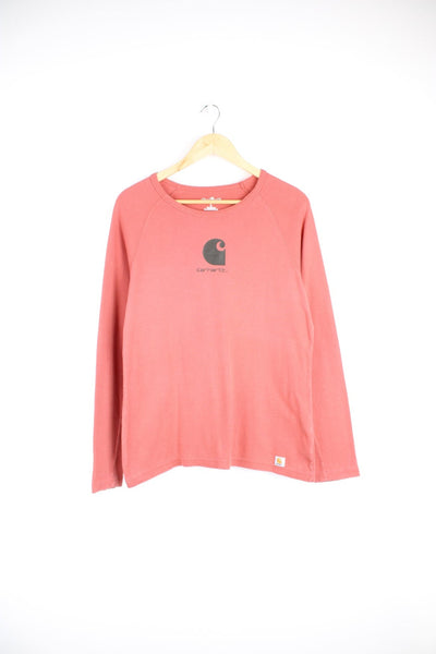 Carhartt For Women Long Sleeved Top in a pink colourway with the logo printed across the front.