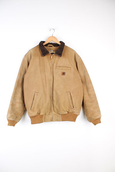 Carhartt Detroit Jacket in a brown colourway with a corduroy collar, zip up with multiple pockets, and has the logo embroidered on the front. 
