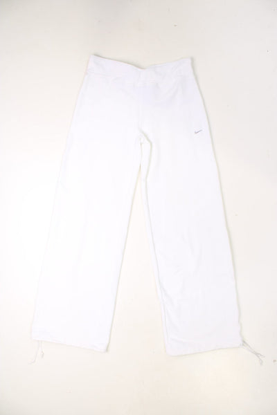 Nike yoga pants with embroidered logo and tie on each cuff, allowing them to be worn wide legged or cuffed.