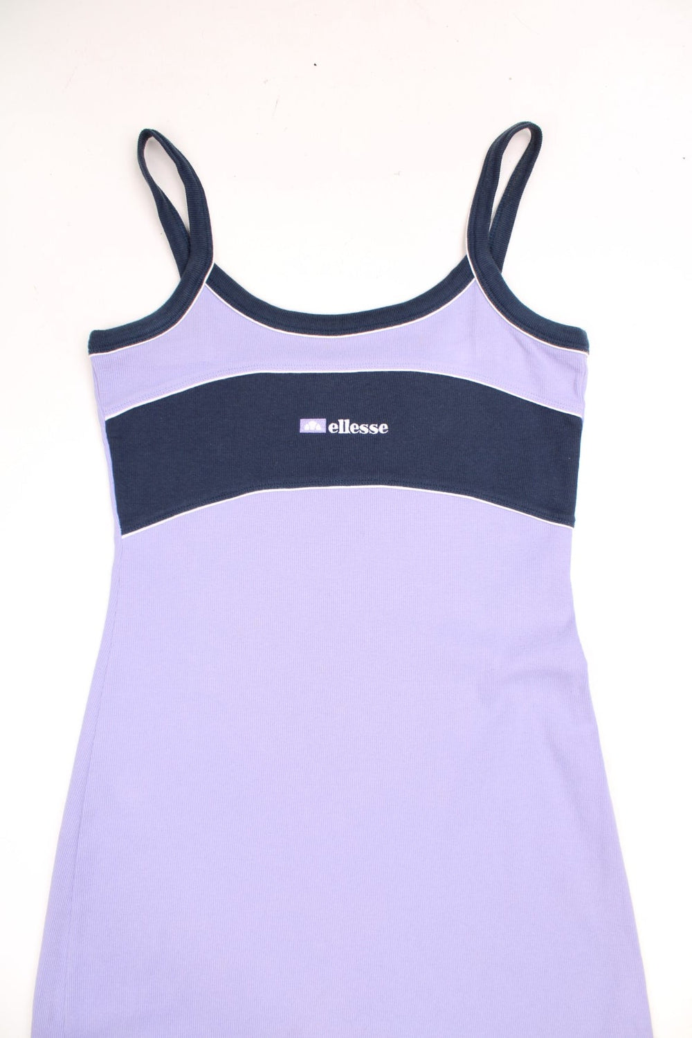 Y2K Ellesse sporty mini dress in lilac with navy blue accents, white piping and an embroidered logo on the chest.