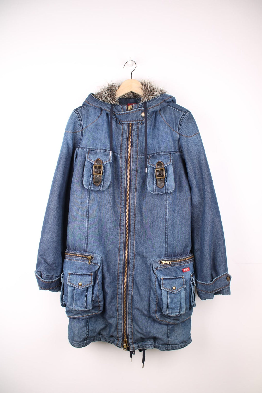 Blue Miss Sixty denim parka with faux fur lined hood, zip closure, eight zip, snap and buckle pockets.