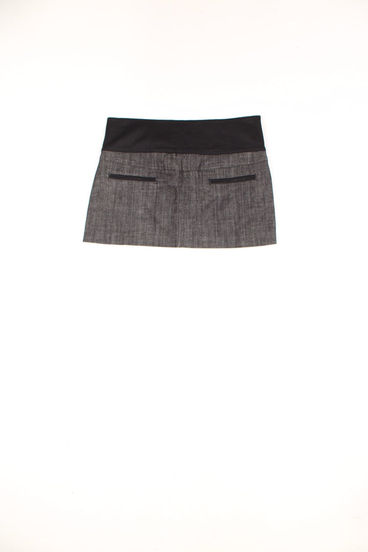 Y2K Pilot low rise mini skirt. Denim mini skirt with silver sequin panel at the front. good condition Size in Label: S/M - Measures like a womens 6 (XS) Our Measurements: Waist: 32 inches Length: 12 inches Please ensure you check all measurements