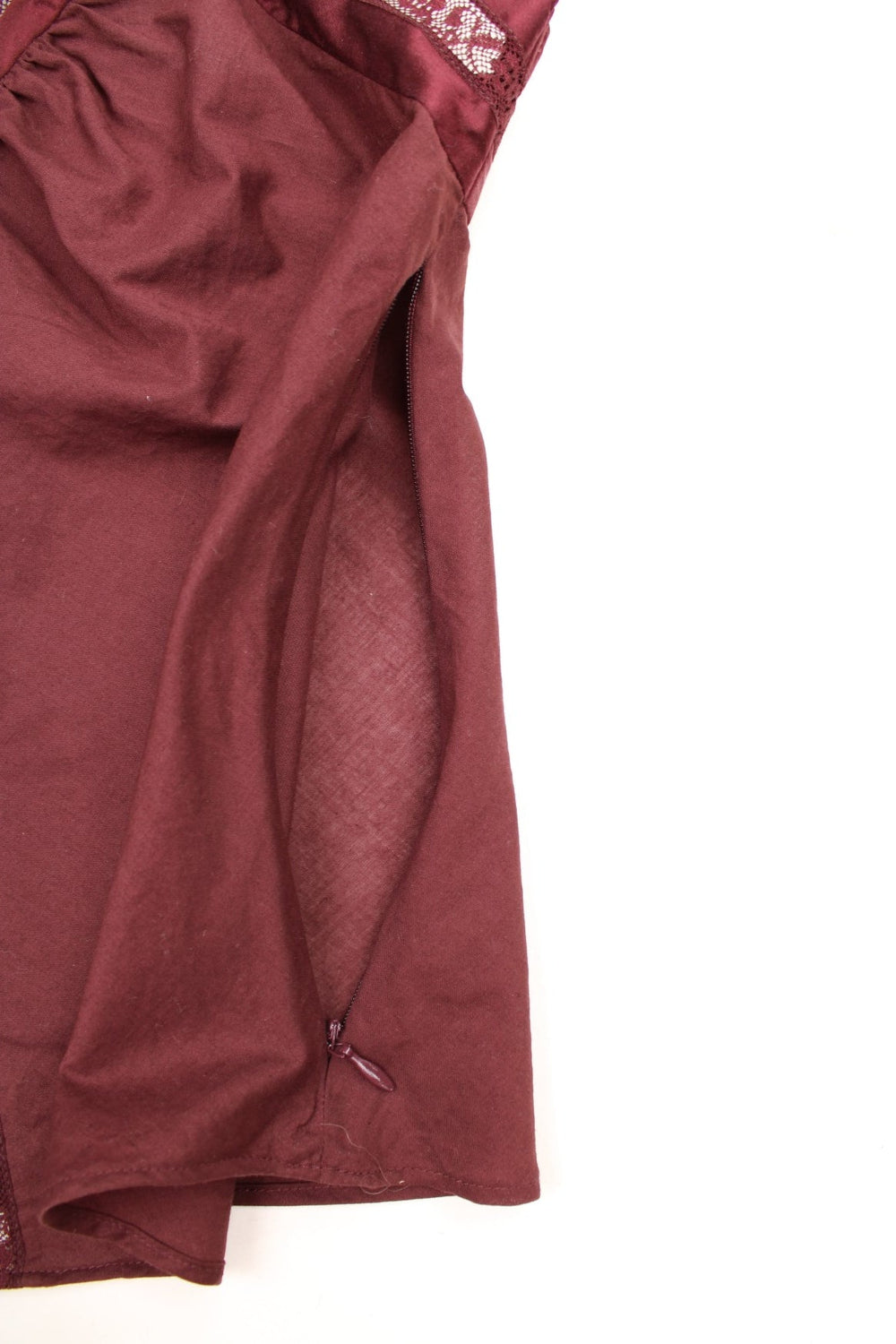 Y2K Limited Collection Cami Top in dark purple. Features lace and satin detailing, zip down the side, and adjustable straps.