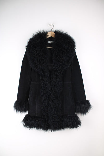 Vintage Cofi Afghan Coat in a black colourway with a big faux fur collar, real leather shell material and has side pockets.