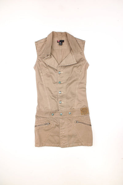 Vintage Diesel button up shirt dress in a brown colourway, has a big collar with side pockets, and has the logo embroidered on the front. 