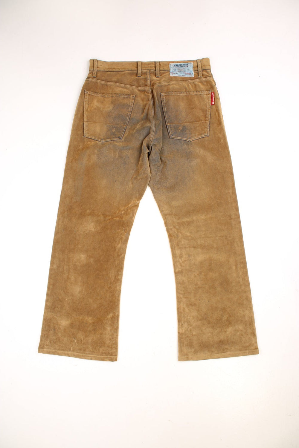Y2K  Distressed Trousers in  colourway, material similar to suede, has pockets and the logo embroidered on the back.