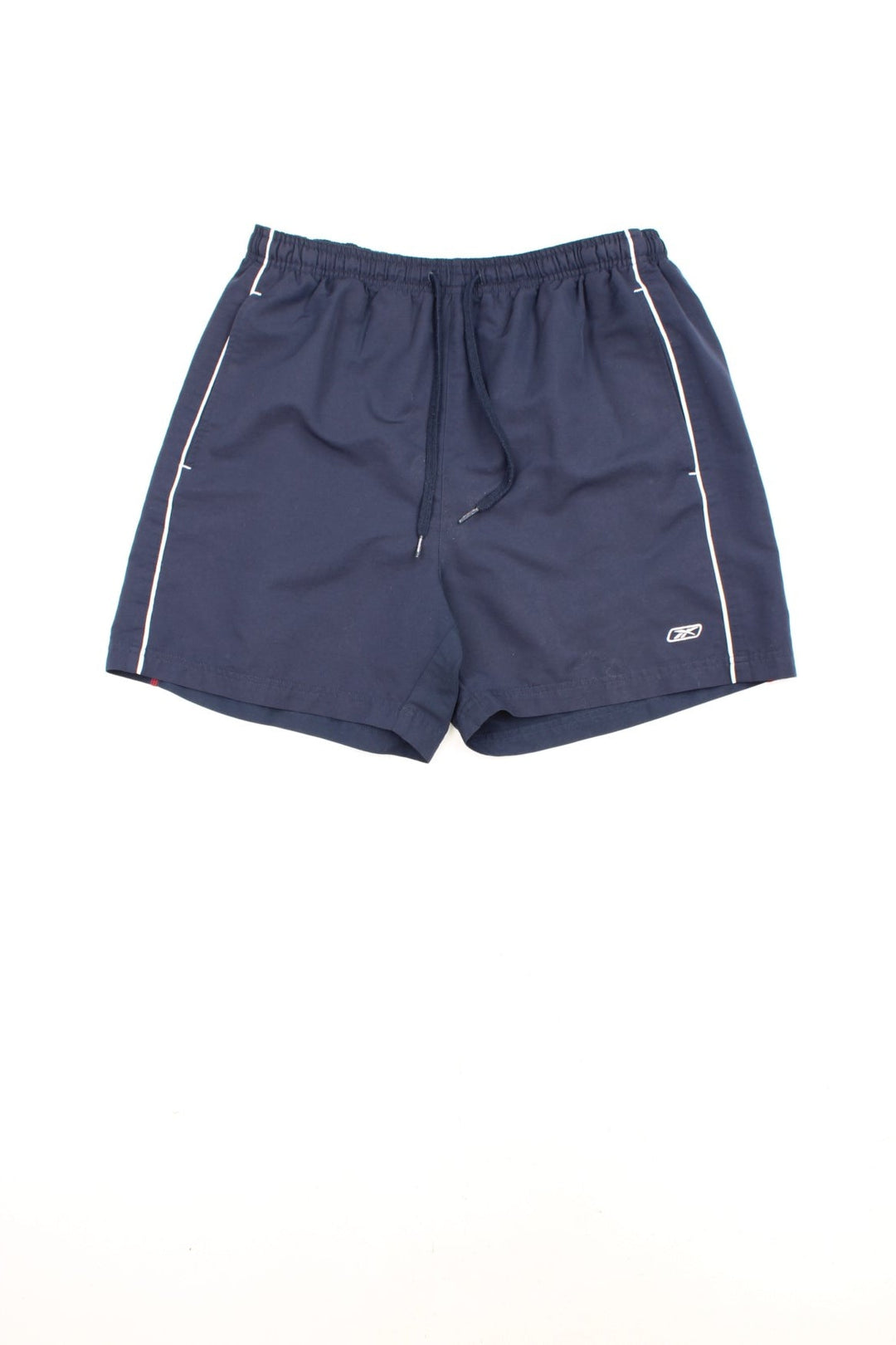 Reebok Shorts in a blue colourway with white stripes going down the sides, has an elasticated waist, mesh netted lining, pockets, and the logo embroidered on the front and down the right side.