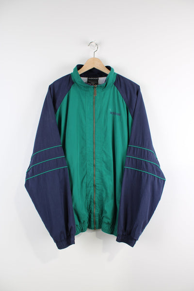 Vintage green and blue Adidas tracksuit jacket with embroidered logo on the chest