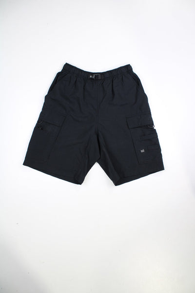 Black Nike ACG cargo shorts. Features embroidered logo on the pocket.