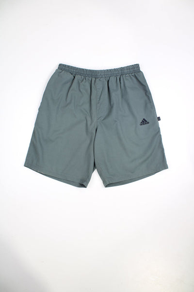 Vintage Adidas shorts with elasticated waist and drawstring. Features embroidered logo.