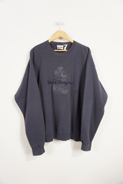 Vintage Disney faded navy blue crewneck sweatshirt with embossed Mickey Mouse and embroidered text