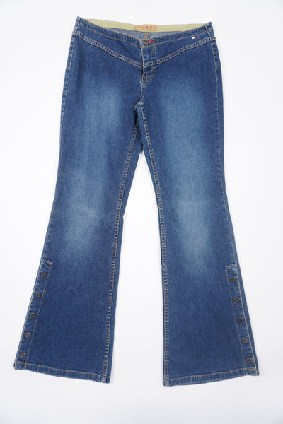 Tommy Hilfiger mid rise, flared jeans with embroidered logo on the hip and button details on the cuffs 