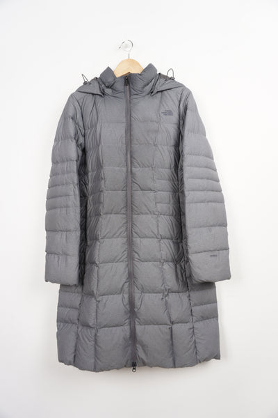 The North Face all grey 550 full length hooded puffer jacket with pockets and embroidered logos on the front and back 