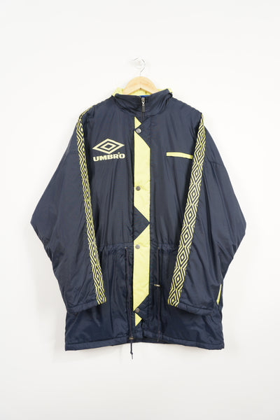 Vintage blue & yellow Umbro coat with embroidered logo on the chest and foldaway hood 
