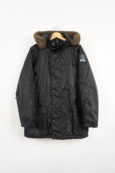 All black Kickers winter coat with detachable hood and embroidered logo on the sleeve