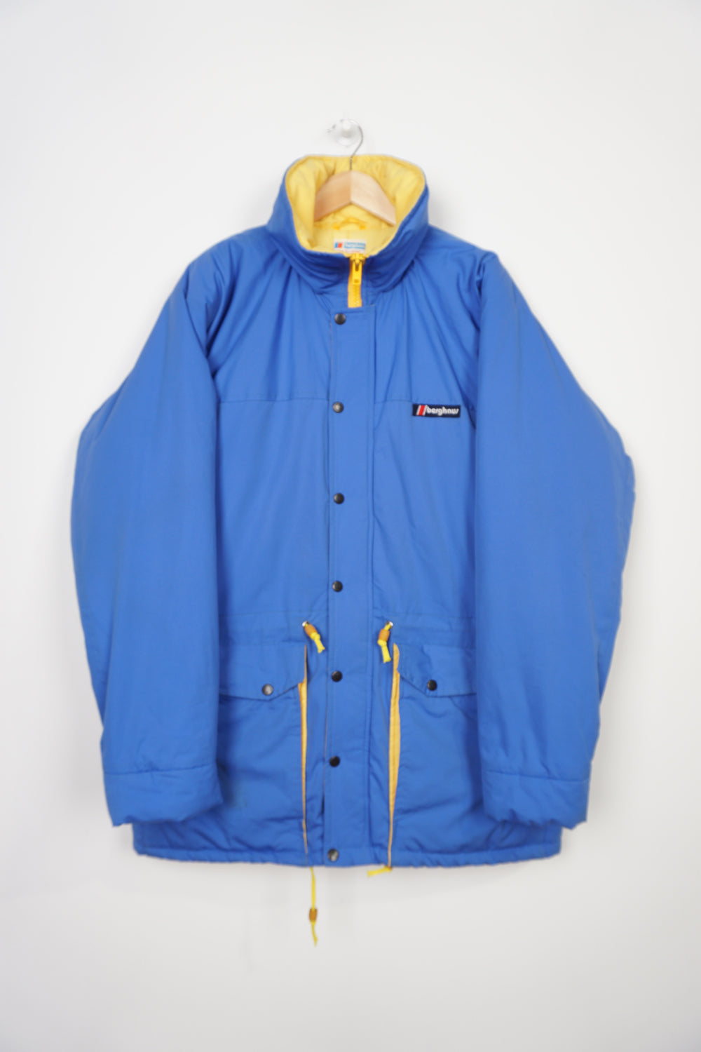 Vintage Berghaus blue Gortex waterproof padded coat with drawstring waist and foldaway hood