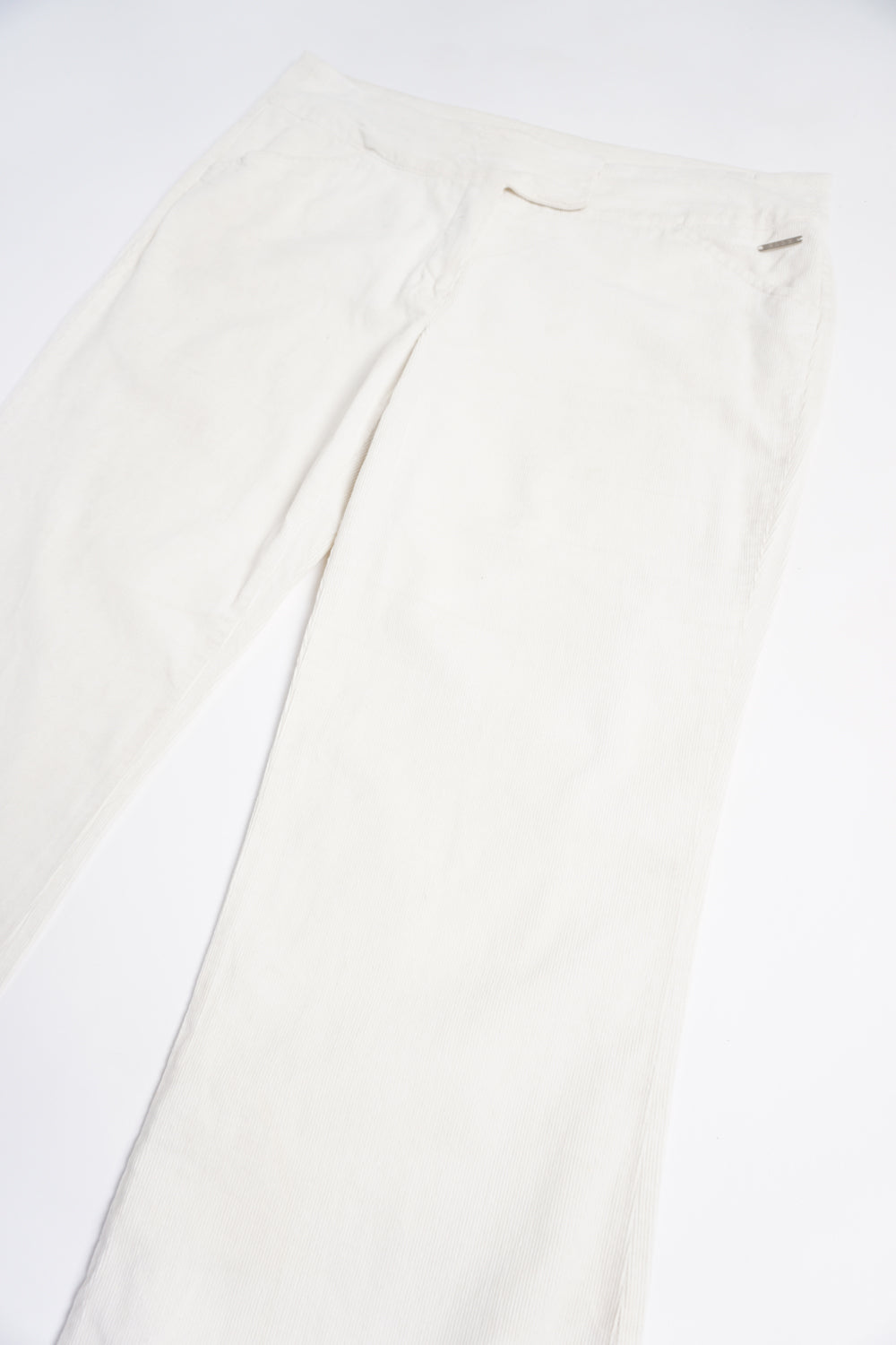 Y2K all white Elle corduroy low rise bootcut trousers with metal 'Elle' detail on the pocket