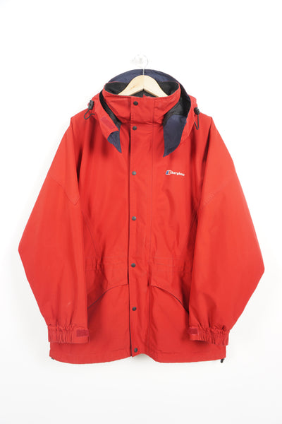 Vintage Berghaus red, zip through waterproof jacket with hood, draw string waist and embroidered logo on the chest
