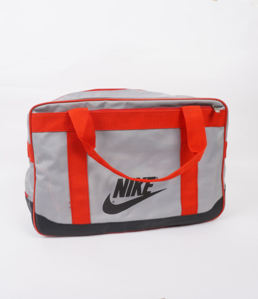 Vintage red and grey Nike spell-out duffle bag