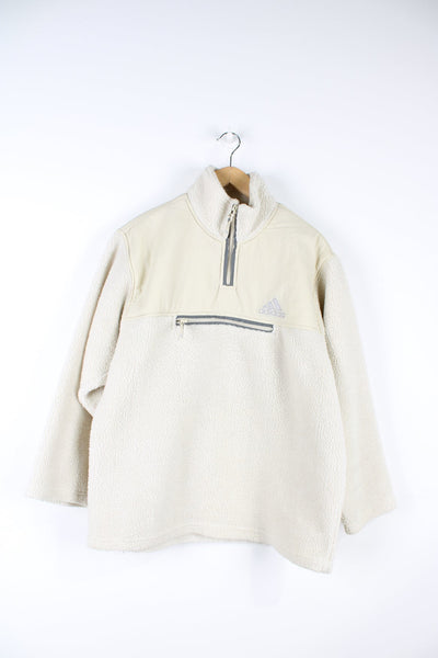 Beige Adidas pullover sherpa fleece with quarter zip and pouch pocket.