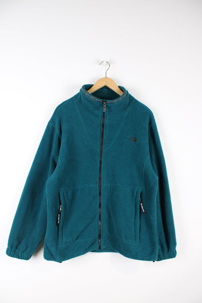 The North Face green zip through fleece. Features embroidered logo on the chest and aztec print detailing on the neck.