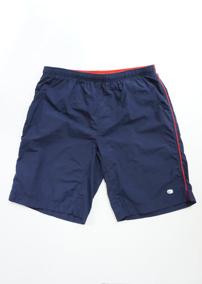Nike navy blue swim shorts with red embroidered text on the back and mesh lining