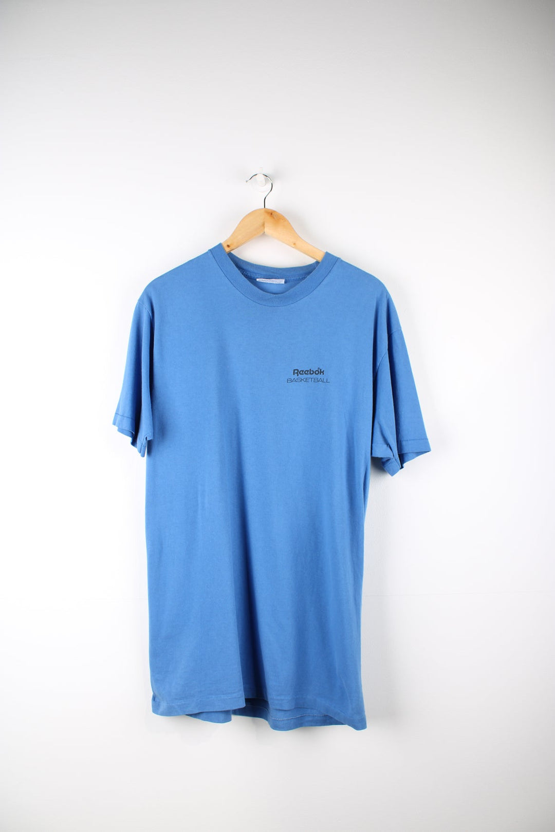 Vintage Reebok Basketball T-Shirt with printed logo on the chest and graphic print on the back.