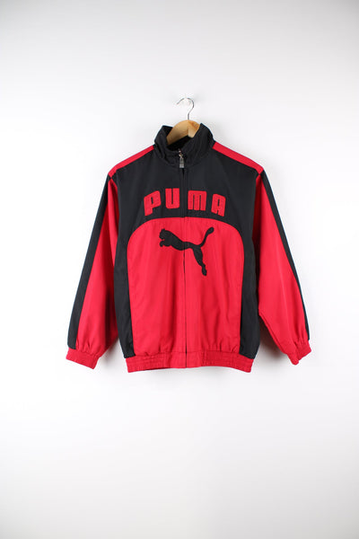 Vintage Puma black and red tracksuit top. Features embroidered logo across the chest and back, and printed logo on the reverse.