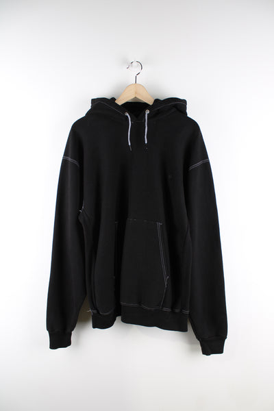 Carhartt 1/4 zip black hoodie, features embroidered logo on the chest and white contrast stitching 