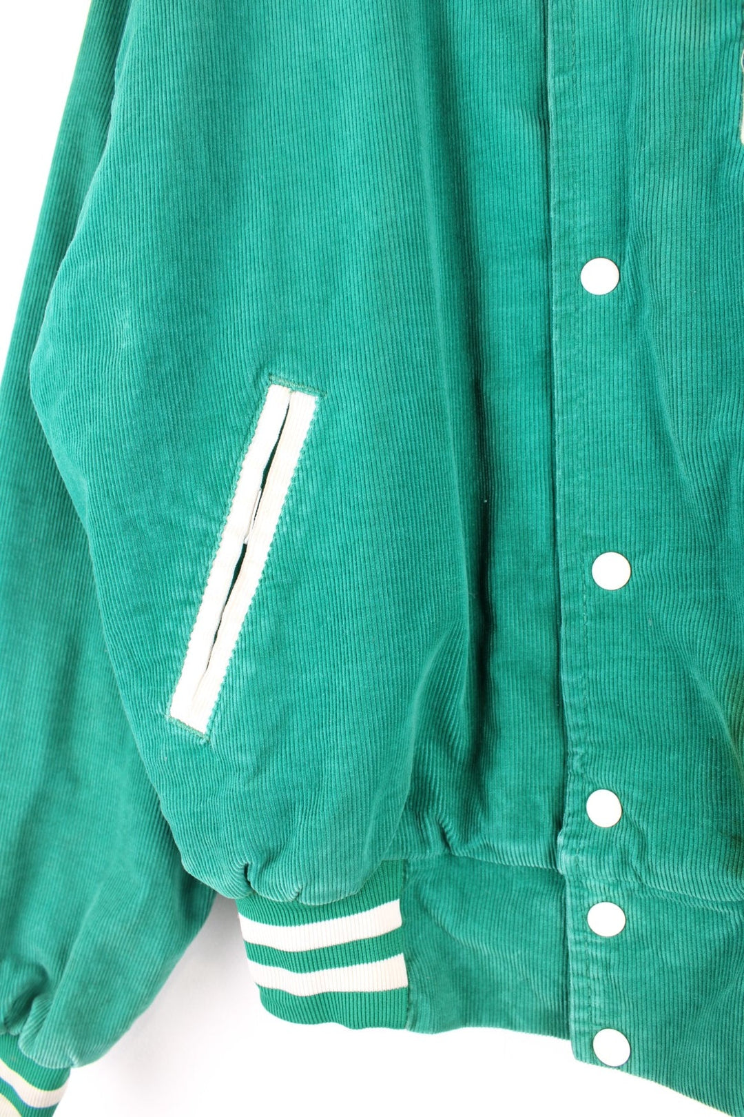 Vintage West Wind / Colchester Laker's corduroy varsity jacket in a green colourway. The jacket has a large Colchester Lakers tufted patch on the front panel, and Colchester is also embroidered on the back. There are jetted pockets, with a contrasting white cord trim and press studs to fasten. Made in the USA. 