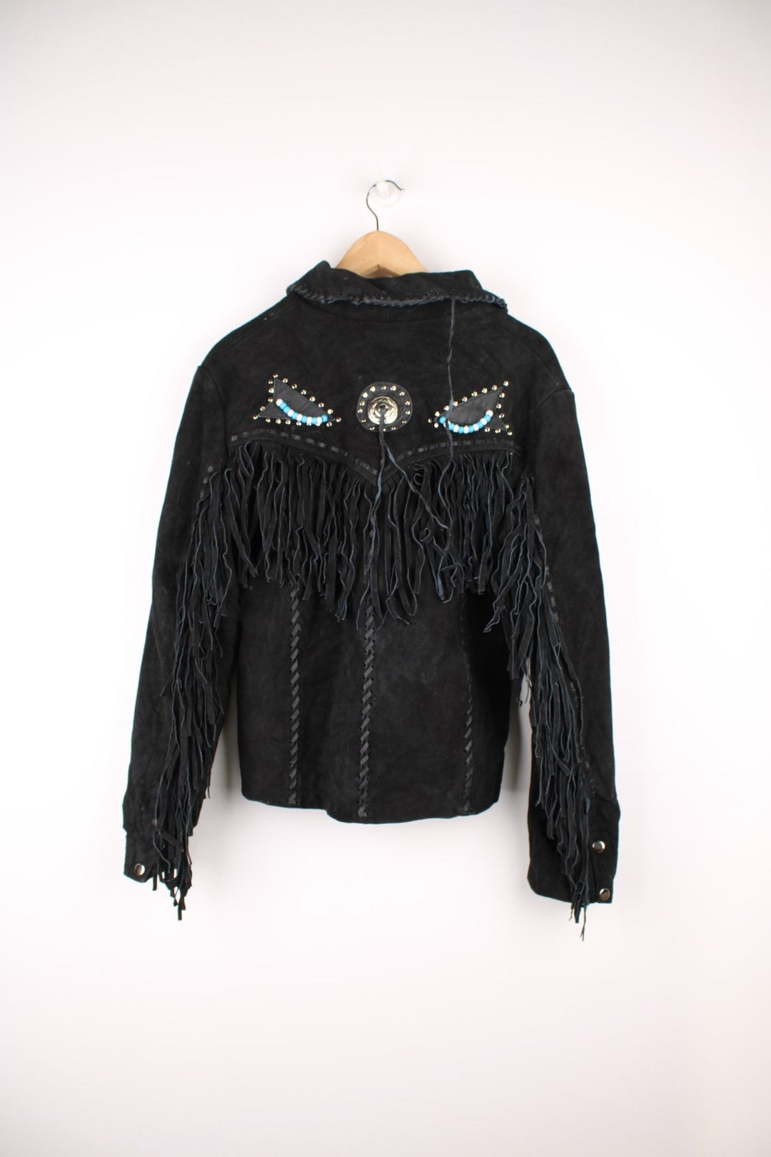 Sema Leathers Western Beaded Fringe Jacket in a black colourway, button up with side pockets, tassels throughout, and has beaded patterns on the front and back. 