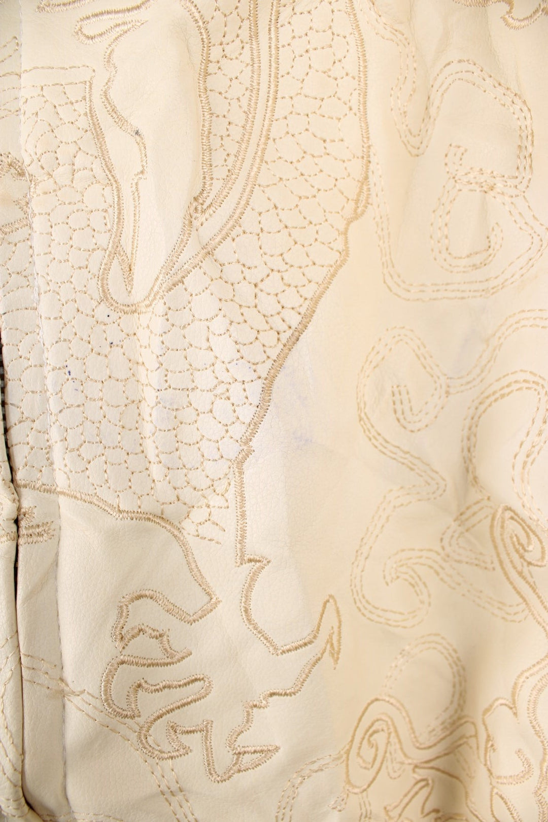 90's Y2K BlueZ Dragon Leather Jacket in a cream colourway, zip up with side pockets, big collar, and has embroidered dragons all over. 