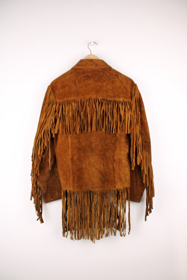 70's Suede Western Fringe Jacket in a brown colourway, button up with double chest pockets, dagger collar, and has tassels all around. 
