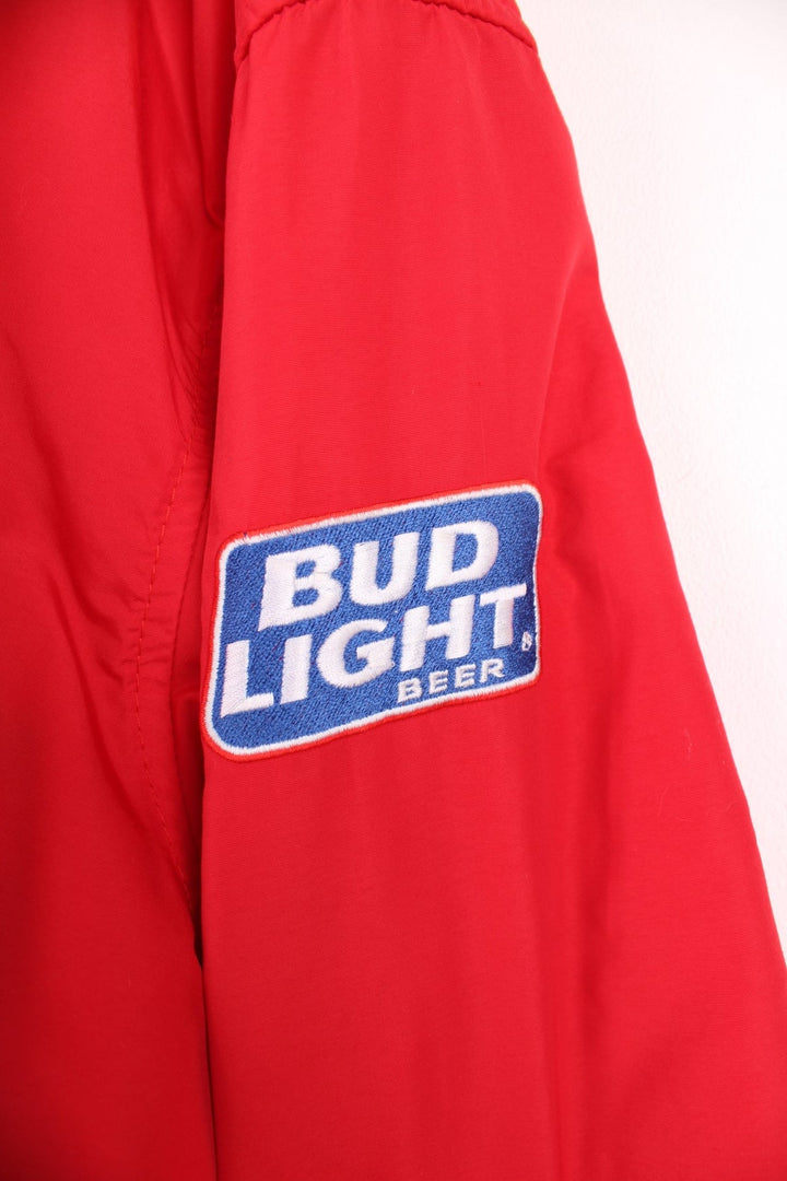 Crown of California bomber jacket in red with snap closure, two pockets and embroidered Budweiser and Bud Light logos on the chest, sleeves and back. 