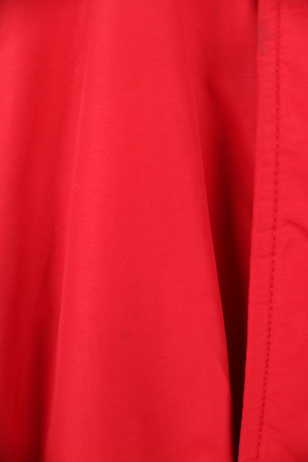 Crown of California bomber jacket in red with snap closure, two pockets and embroidered Budweiser and Bud Light logos on the chest, sleeves and back. 
