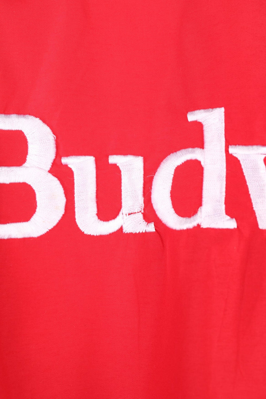 Crown of California bomber jacket in red with snap closure, two pockets and embroidered Budweiser and Bud Light logos on the chest, sleeves and back. 
